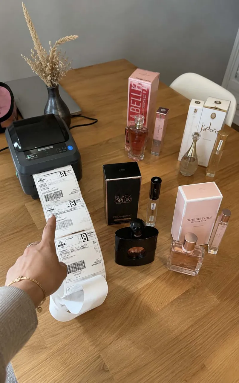A mum packing up the products of her new perfume online store