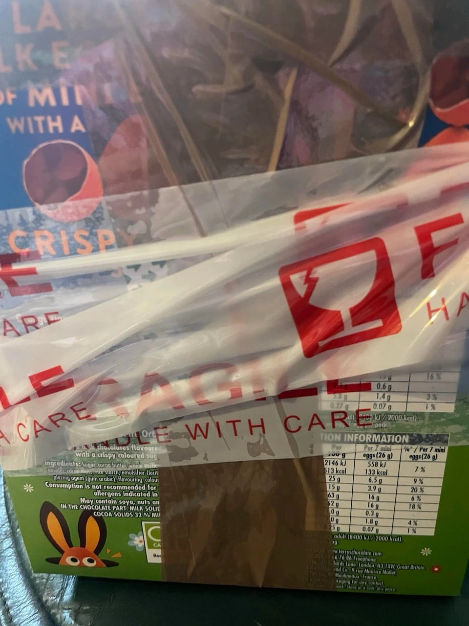 A sold item wrapped in fragile tape, ready to ship